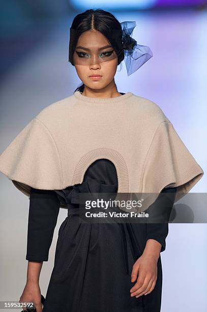 Model showcases designs on the runway by Johanna Ho during the Extravaganza show on day 1 of Hong Kong Fashion Week Autumn/Winter 2013 at the...