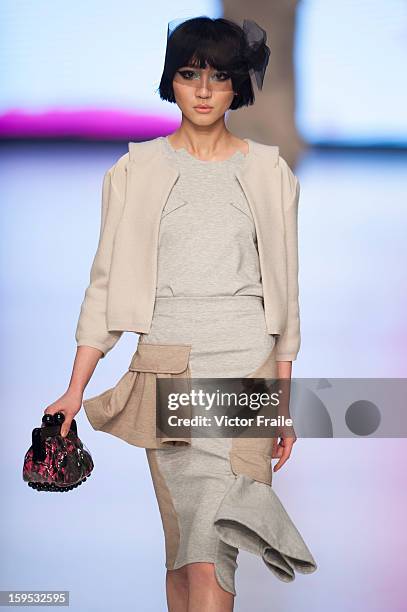 Model showcases designs on the runway by Johanna Ho during the Extravaganza show on day 1 of Hong Kong Fashion Week Autumn/Winter 2013 at the...