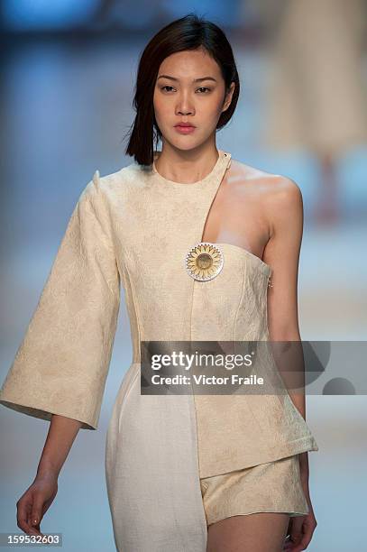 Model showcases designs on the runway by Nana Aganovich & Brooke Taylor during the Extravaganza show on day 1 of Hong Kong Fashion Week Autumn/Winter...