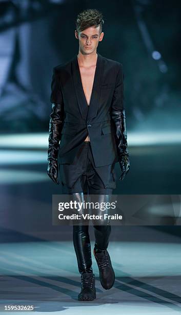 Model showcases designs on the runway by Chi Zhang during the Extravaganza show on day 1 of Hong Kong Fashion Week Autumn/Winter 2013 at the...