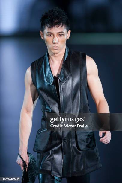 Model showcases designs on the runway by Chi Zhang during the Extravaganza show on day 1 of Hong Kong Fashion Week Autumn/Winter 2013 at the...