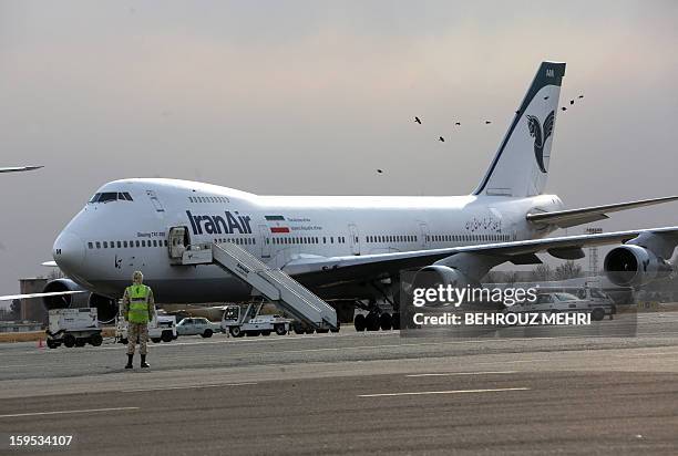 An Iran Air Boeing 747 passenger plane sits on the tarmac of the domestic Mehrabad airport in the Iranian capital Tehran on January 15, 2013....