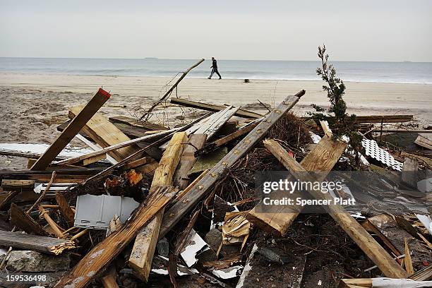 Discarded items from flood damaged homes after Hurricane Sandy sit along the beach in the Rockaways on January 15, 2013 in the queens borough of New...