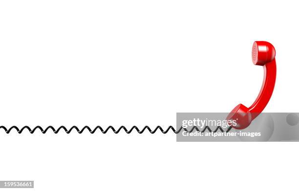 red phone reciever on a spiral cord on white - receptor de telefone - fotografias e filmes do acervo