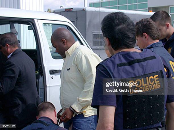 Customs officials meet fugitive James Spencer Springette in Miami after his arrest in Venezuela in this undated photo. Customs officials announced...