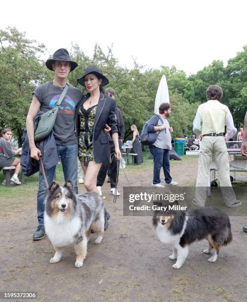 Perry Farrell and wife Etty Farrell walk their dogs Cloud & Stormy backstage during Lollapalooza at Grant Park on August 05, 2023 in Chicago,...