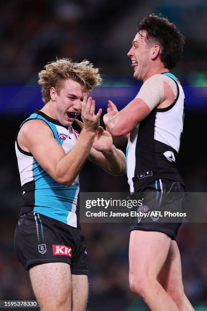 Jason Horne-Francis and Zak Butters of the Power celebrate a goal during the 2023 AFL Round 22 match between the Port Adelaide Power and the GWS...