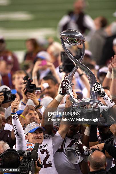 Cotton Bowl Classic: Texas A&M QB Johnny Manziel and teammates victorious on field with trophy after winning game vs Oklahoma at Cowboys Stadium....