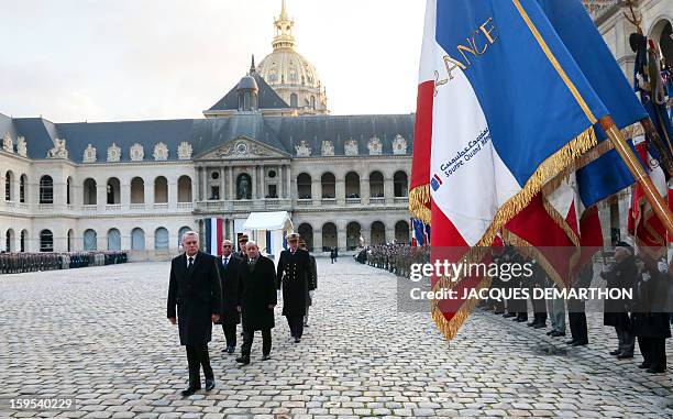 French Prime Minister Jean-Marc Ayrault , followed by Defence Minister Jean-Yves Le Drian, junior minister for veterans affairs Kafer Arif, and...