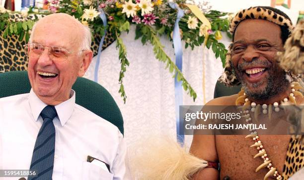 File photo taken 16 December 2003 shows former South African President of the apartheid regime PW Botha laughing with Zulu King Goodwill Zwelithini...