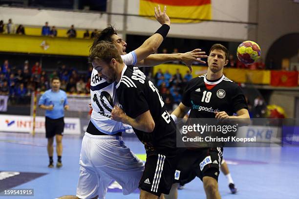 Kevin Schmidt of Germany and Martin Strobel of Germany defend against Frederico Vieyra of Argentina during the premilary group A match between...