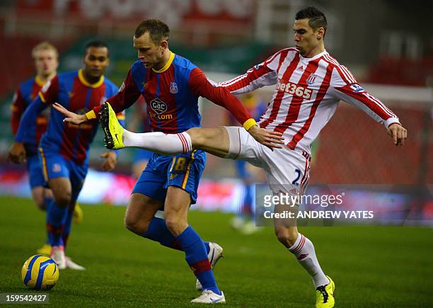 Stoke City's US defender Geoff Cameron vies with Crystal Palace's English forward Aaron Wilbraham during the English FA Cup third round replay...