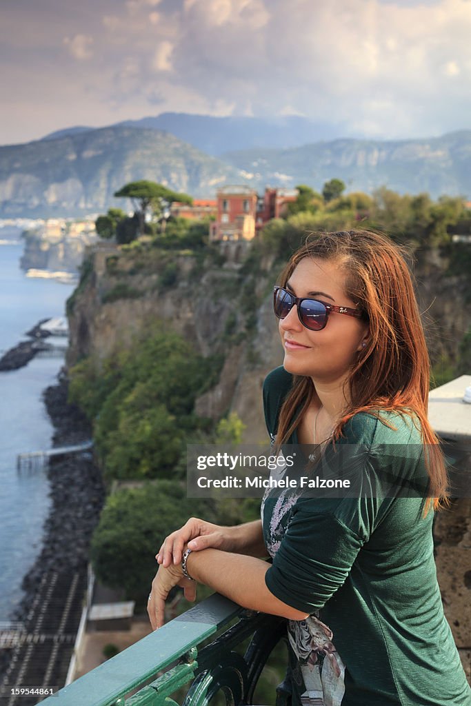 Young woman overlooking the Sorrento coast, Italy