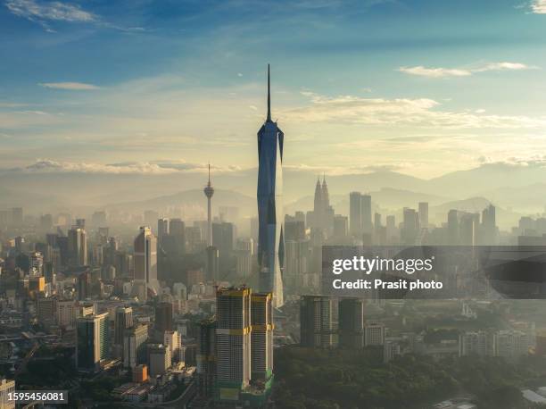 aerial view of kuala lumpur showing merdeka tower 118 and other skyscrapers during sunrise time in kuala lumpur malaysia - kuala lumpur stockfoto's en -beelden