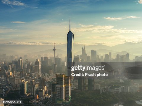 Aerial view of Kuala Lumpur showing Merdeka Tower 118 and other skyscrapers during sunrise time in Kuala Lumpur Malaysia Aerial view of Kuala Lumpur showing Merdeka Tower 118 and other skyscrapers during sunrise time in Kuala Lumpur Malaysia