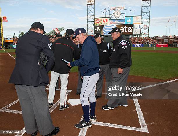 Jim Leyland manager of the Detroit Tigers talks with umpire Gerry Davis before Game One of the 2012 World Series between the Detroit Tigers and the...