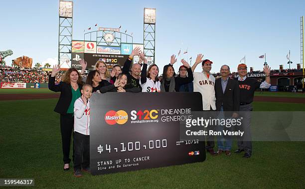 MasterCard presents Stand Up 2 Cancer a check from their Dine and be Generous program before Game One of the 2012 World Series between the Detroit...