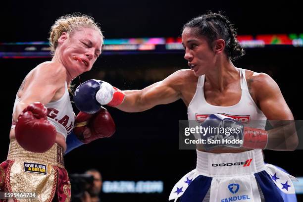 Amanda Serrano hits Heather Hardy with a right during the seventh round of their fight at the American Airlines Center on August 05, 2023 in Dallas,...