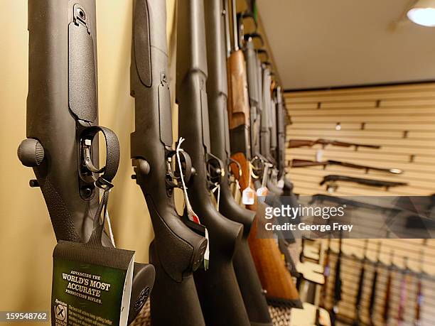 Various shotguns and rifles are on display to purchase at the "Get Some Guns & Ammo" shooting range on January 15, 2013 in Salt Lake City, Utah....