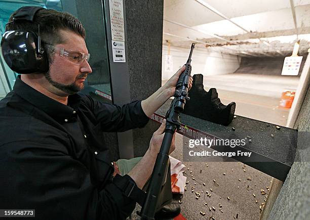 Brett Nielsen prepares to fire an AR-15 rifle at the "Get Some Guns & Ammo" shooting range on January 15, 2013 in Salt Lake City, Utah. Lawmakers are...