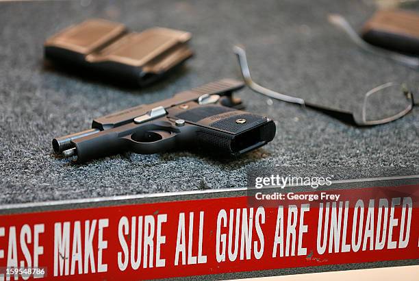 Handgun lays on a table after being fired at the "Get Some Guns & Ammo" shooting range on January 15, 2013 in Salt Lake City, Utah. Lawmakers are...