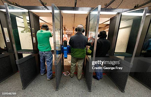 People fire various guns at the "Get Some Guns & Ammo" shooting range on January 15, 2013 in Salt Lake City, Utah. Lawmakers are calling for tougher...