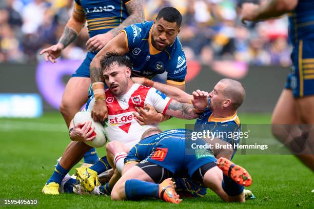 Jack Bird of the Dragons is tackled during the round 23 NRL match between Parramatta Eels and St George Illawarra Dragons at CommBank Stadium on...