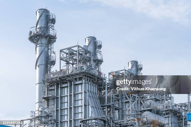 power plant and pipeline included steam turbine generator and stack tower. - oil refinery stock pictures, royalty-free photos & images