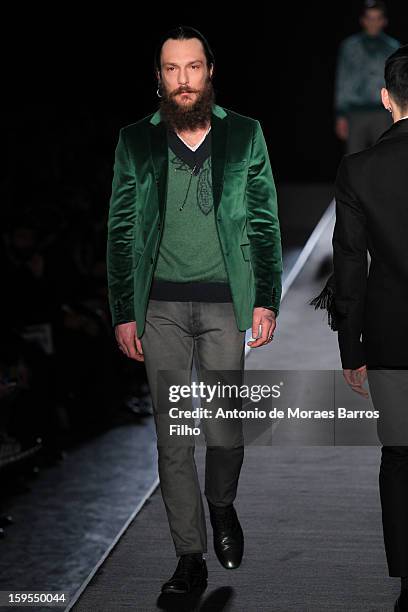 Model walks the runway during the Diesel Black Gold show as part of Milan Fashion Week Menswear Autumn/Winter 2013 on January 15, 2013 in Milan,...