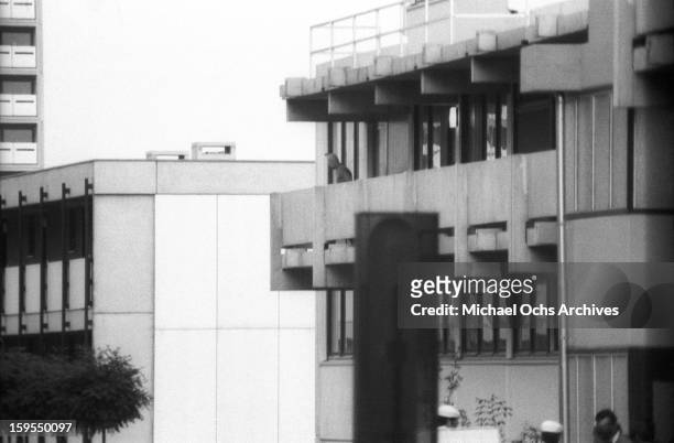 Member of the Black September Organization stands on the balcony of the Israili Olympic team quarters, where the group are holding 9 surviving...