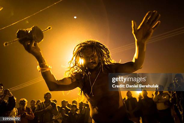 Hindu devotees bathe on the banks of Sangam, the confluence of the waters of the holy rivers Ganges, Yamuna and the mythical Saraswati, during the...