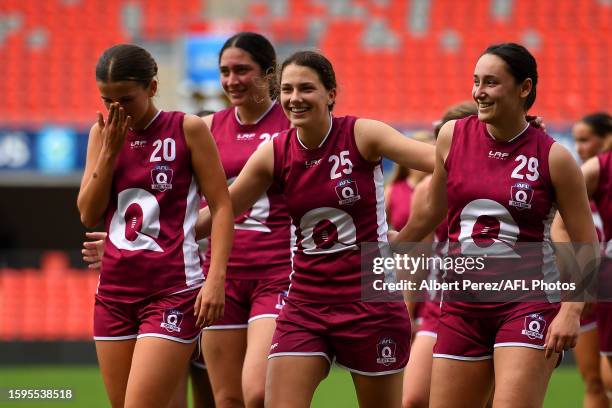 Mia Salisbury, Kiara Bischa and Ella Calleja of Queensland celebrate victory during the AFL National Championships U18 Girls match between Queensland...