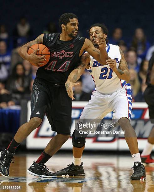 Jaquon Parker of the Cincinnati Bearcats tries to move past Jamee Crockett of the DePaul Blue Demons at Allstate Arena on January 15, 2013 in...