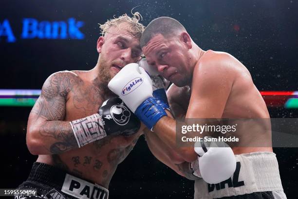 Jake Paul and Nate Diaz trade punches during the tenth round of their fight at the American Airlines Center on August 05, 2023 in Dallas, Texas.