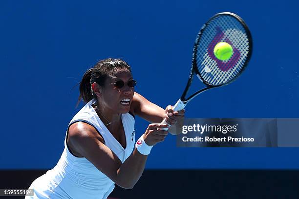 Stephanie Foretz Gacon of France plays a forehand in her second round match against Ekaterina Makarova of Russia during day three of the 2013...