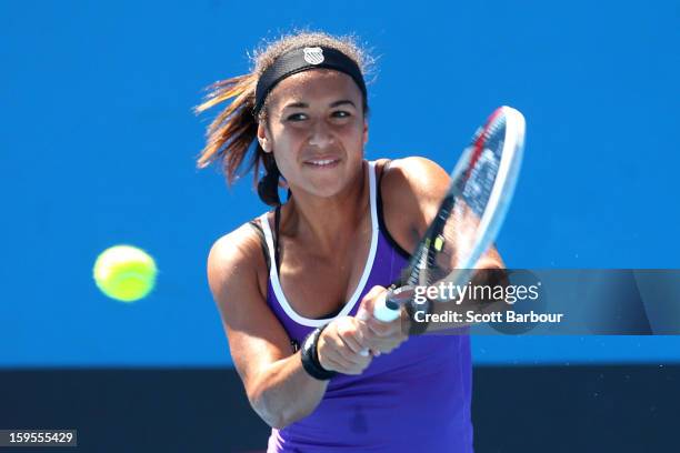 Heather Watson of Great Britain plays a backhand in her second round match against Ksenia Pervak of Kazakhstan during day three of the 2013...