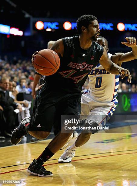 Jaquon Parker of the Cincinnati Bearcats moves past Worrel Clahar of the DePaul Blue Demons at Allstate Arena on January 15, 2013 in Rosemont,...
