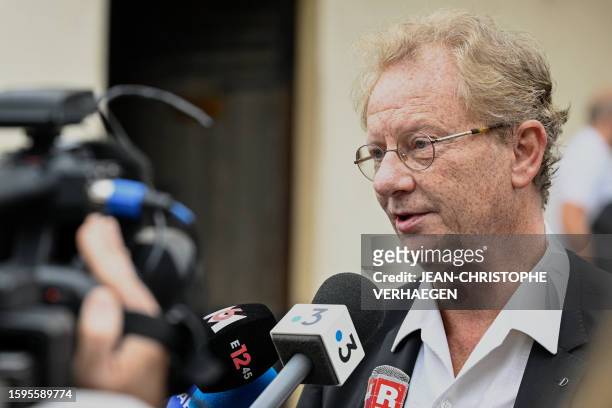 Eric Munier, mayor of Amneville, addresses media after he attended a mass in memory of four of the eleven victims from the APEI Val de l'Orne...