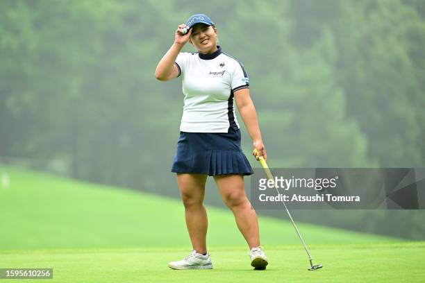 Ai Suzuki of Japan acknowledges the gallery after the birdie on the 8th green during the final round of Hokkaido meiji Cup at Sapporo International...