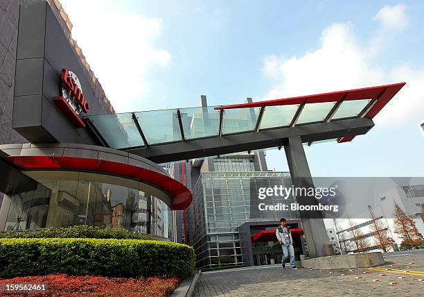 Man exits the Taiwan Semiconductor Manufacturing Co. Headquarters in Hsinchu, Taiwan, on Wednesday, Jan. 16, 2013. Taiwan Semiconductor Manufacturing...