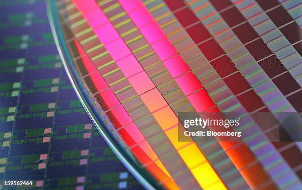 Silicon wafers made by Taiwan Semiconductor Manufacturing Co. Are arranged for a photograph at the company's headquarters in Hsinchu, Taiwan, on...