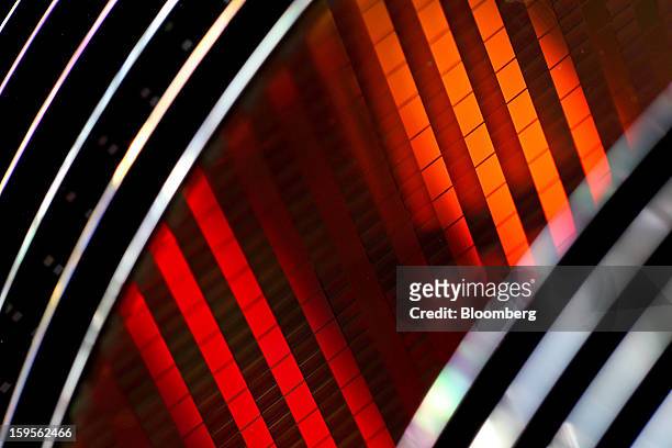 Silicon wafers made by Taiwan Semiconductor Manufacturing Co. Are arranged for a photograph at the company's headquarters in Hsinchu, Taiwan, on...
