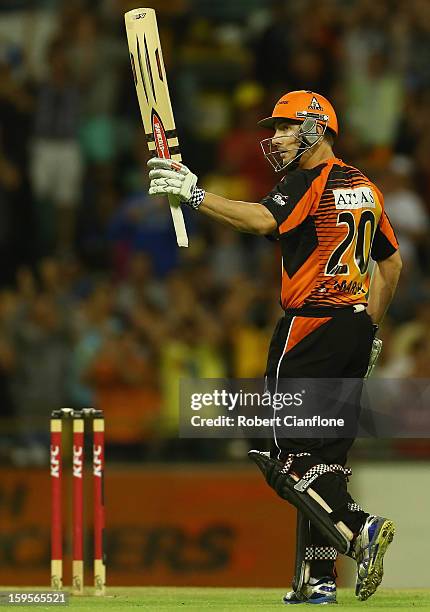 Shaun Marsh of the Perth Scorchers celebrates scoring his half century during the Big Bash League semi-final match between the Perth Scorchers and...