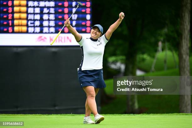 Ai Suzuki of Japan celebrates winning the tournament on the 18th green during the final round of Hokkaido meiji Cup at Sapporo International Country...