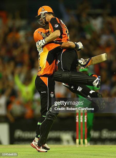 Michael Hussey and Adam Voges of the Perth Scorchers celebrate after the Scorchers defeated the Stars during the Big Bash League semi-final match...