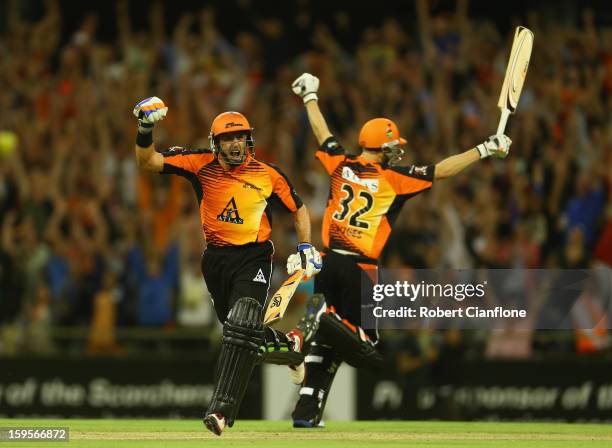 Michael Hussey and Adam Voges of the Perth Scorchers celebrate after the Scorchers defeated the Stars during the Big Bash League semi-final match...