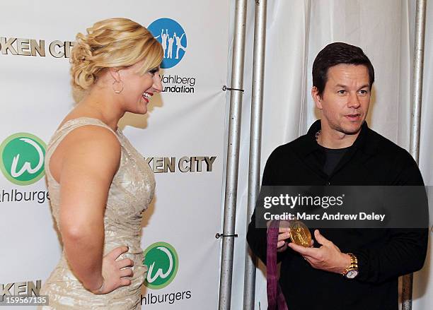 Judo Olympic Gold Medalist Kayla Harrison and Mark Wahlberg speak before the screening of "Broken City" hosted by Mark Wahlberg at Patriot Cinemas on...