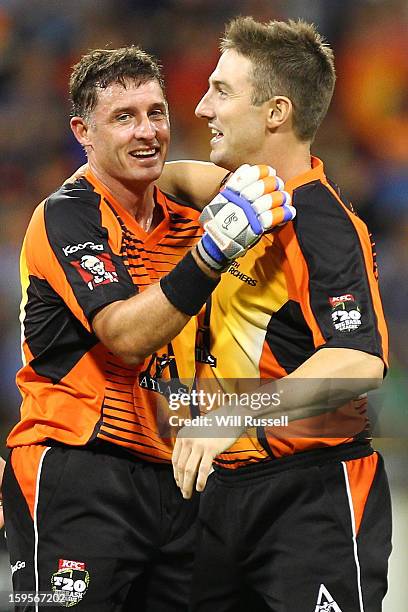 Michael Hussey and Shaun Marsh of Scorchers celebrate after their team's victory during the Big Bash League semi-final match between the Perth...