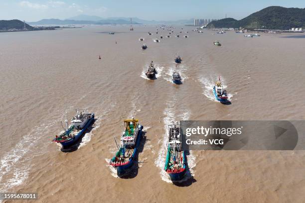 Aerial view of fishing boats setting sail for fishing after the summer fishing ban on the East China Sea was partially lifted on August 6, 2023 in...