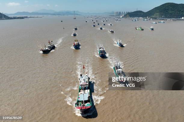 Aerial view of fishing boats setting sail for fishing after the summer fishing ban on the East China Sea was partially lifted on August 6, 2023 in...